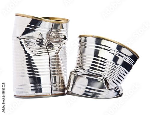 Two damaged tin cans