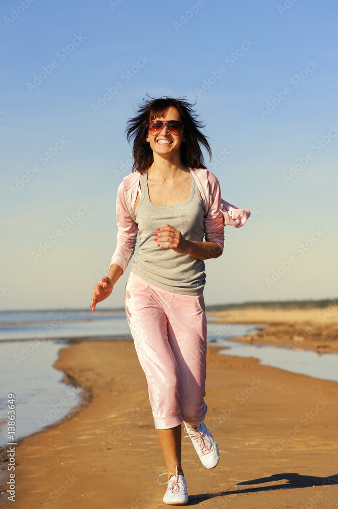 Young woman relaxing on the beach Young woman relaxing on the beach