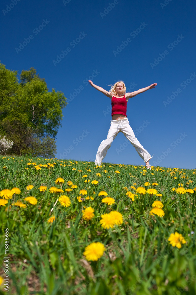 young woman in red outfit having fun on meadow young woman in red outfit having fun on meadow