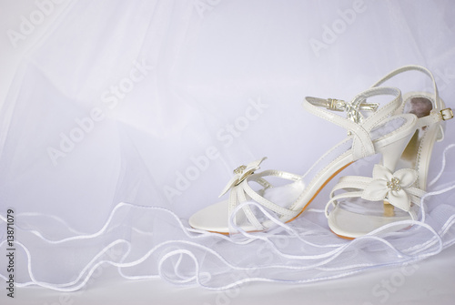wedding sandals and flowers over veil