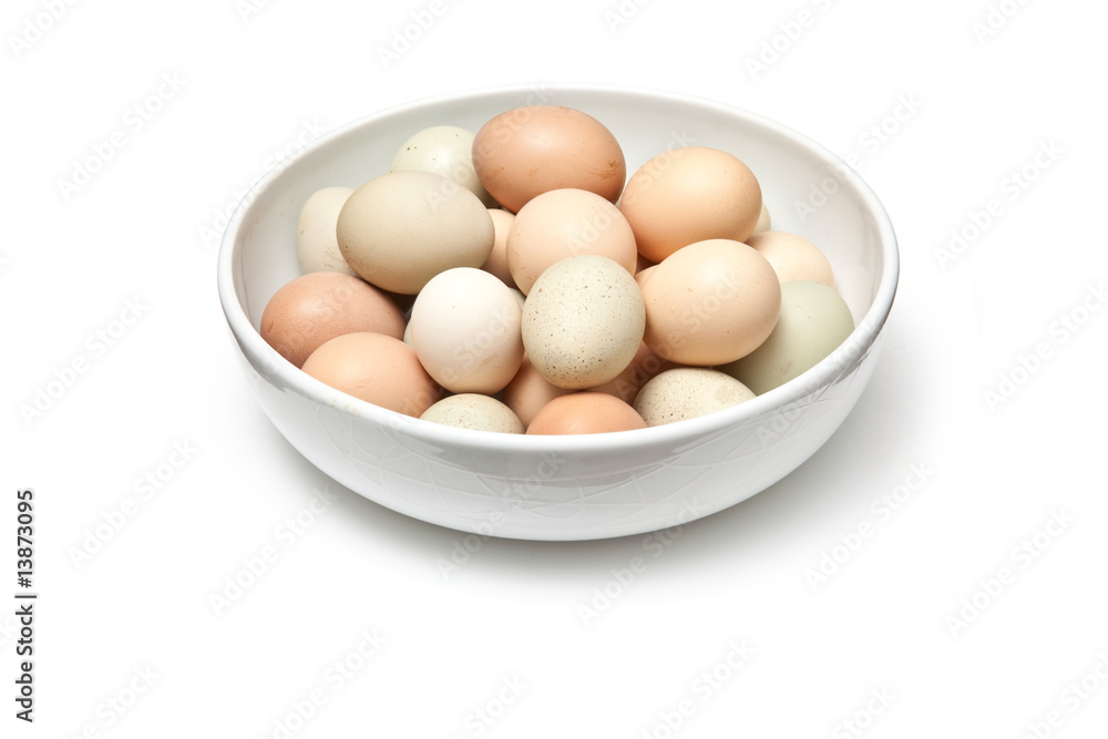 Bowl of free range eggs on a white background. Bowl of free range eggs on a white background.