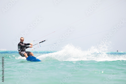 Kiteboarder surfing