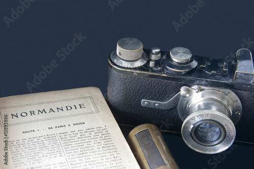 Camera and guidebook to Normandy France