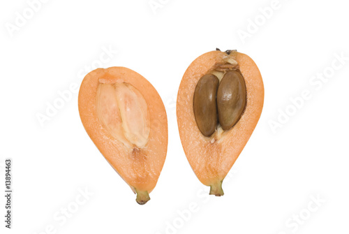 Sections of loquat isolated on white background photo