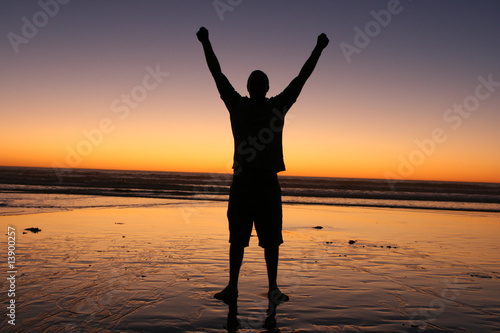 Принти на полотні Man Raising Hands in Sunset