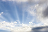 Sun rays emanating from sunlit clouds