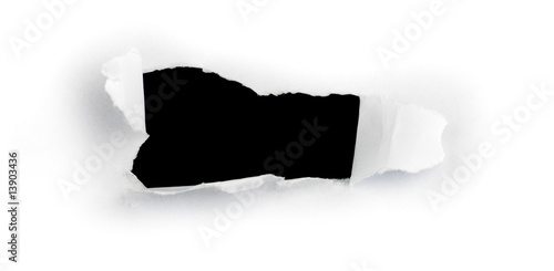 image d'un trou dans une feuille de papier pour message photo