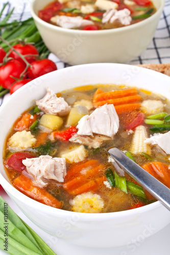 two servings of chicken and vegetable soup