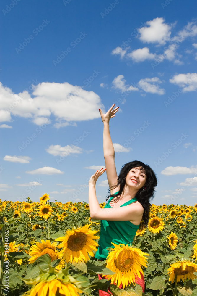 fun woman in the field of sunflowers fun woman in the field of sunflowers
