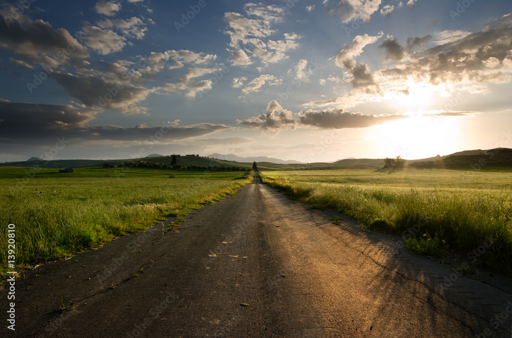 long straight road midle of rural area long straight road midle of rural area