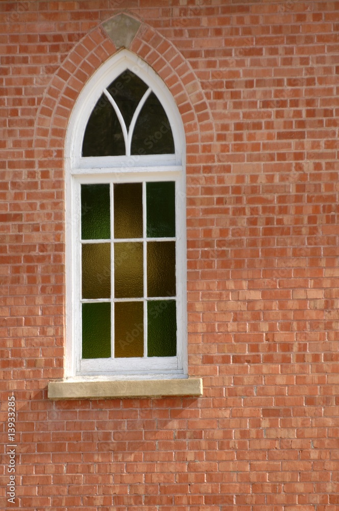 A stained glass window of a church