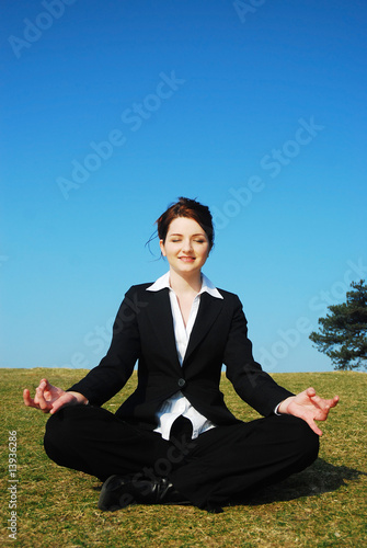 Businesswoman meditating © Katie Little