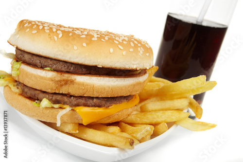 Hamburger meal served with french fries and soda close-up
