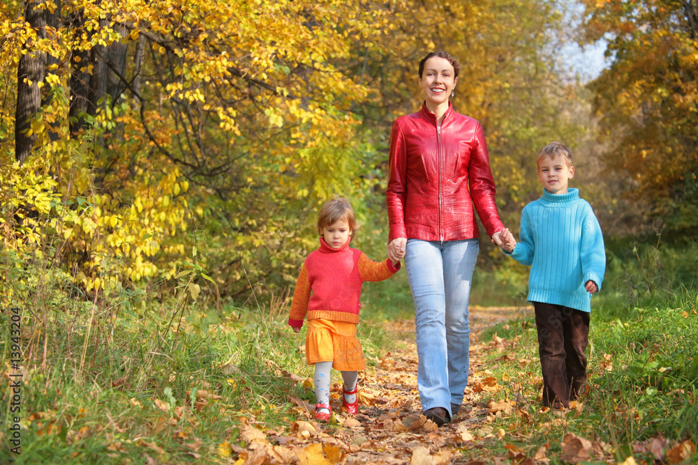 Fototapeta premium Mother with children on walk in wood