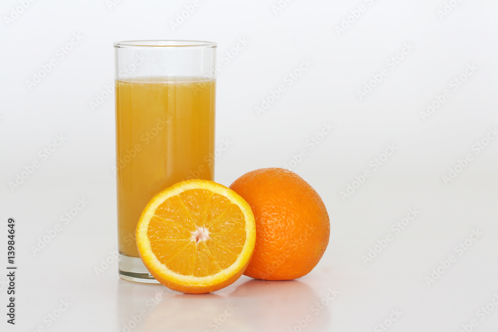 A glass of fresh orange juice on a white background A glass of fresh orange juice on a white background