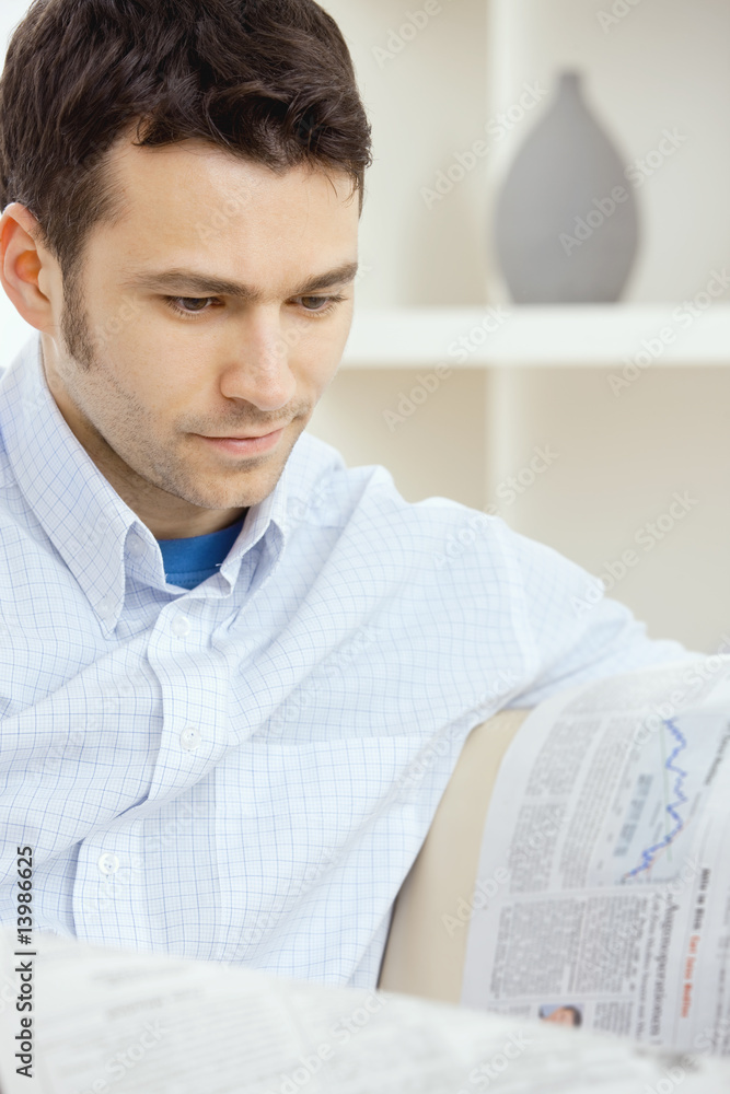 Busnessman reading newspaper