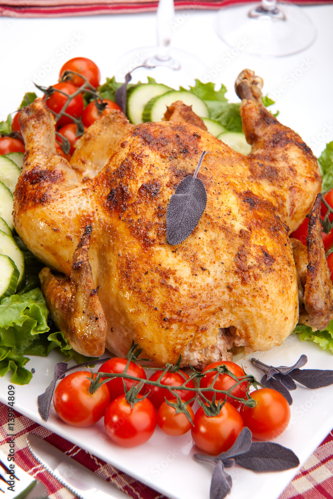 Whole roasted chicken on table Whole roasted chicken on table