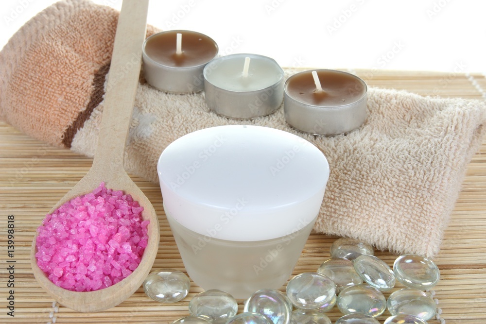 cream and bath salt with towels and candles - body care