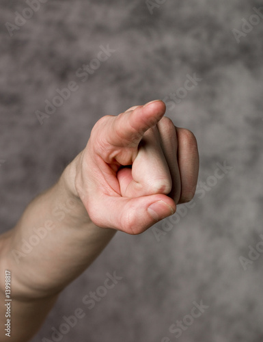 Pointing finger towards grey background