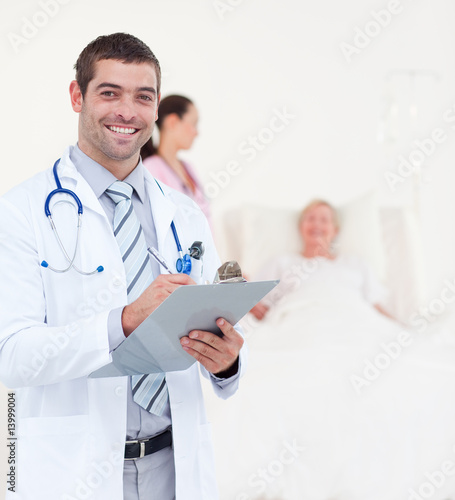 Doctors looking after a senior patient