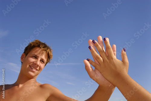 Boy touching a girl's hand in a romantic way