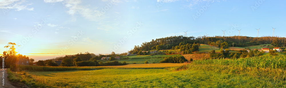 Sun rising on a country scene