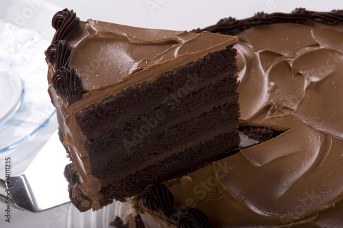 Chocolate Cake being sliced photo