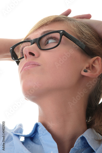 Portrait of a thoughtful young woman looking up