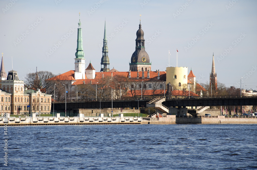 The Riga castle against spikes of cathedrals and churches,