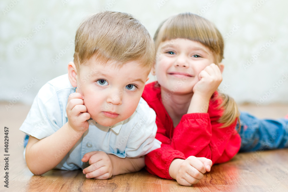 funny boy and a girl lying on the floor funny boy and a girl lying on the floor