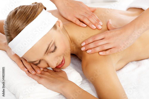 Young beautiful and relaxed lady taking spa treatment