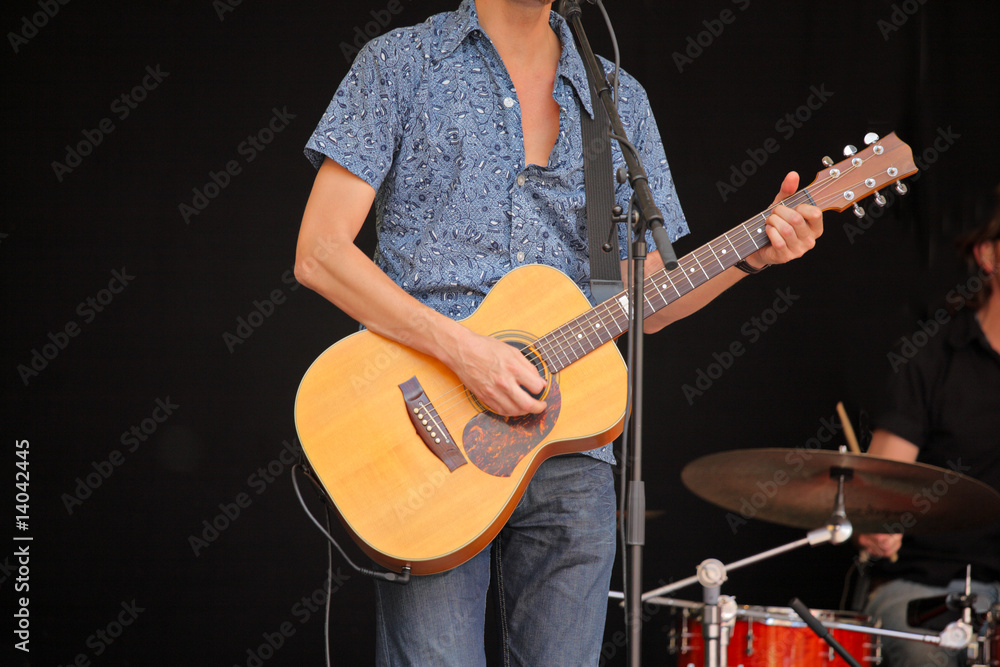 Obraz premium A view of a young guitar player