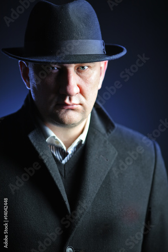 A man with a hat isolated on black background