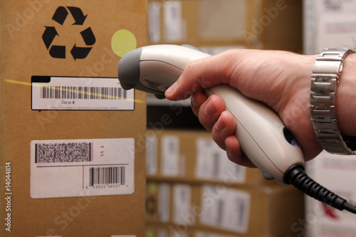 Man hand with barcode scanner in operation.