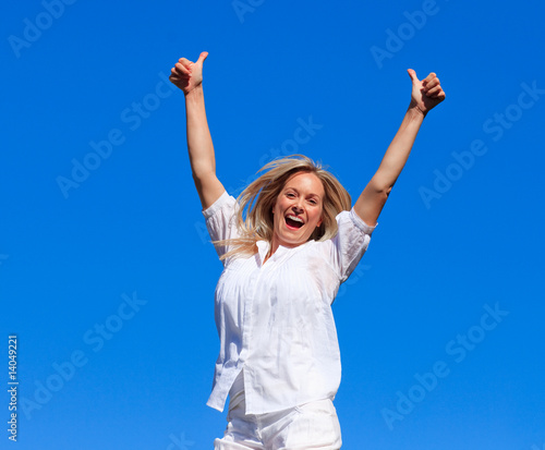 Attractive woman jumping in the air
