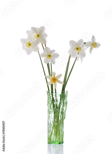 daffodils in green glassvase