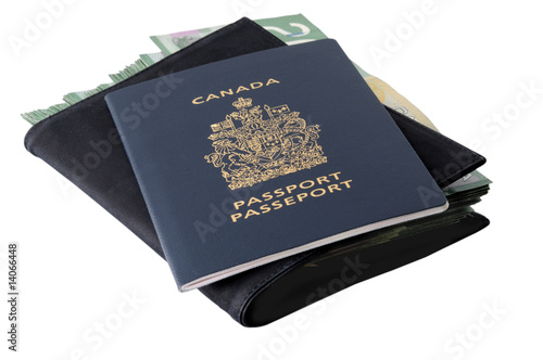 Canadian passport and banknotes photo