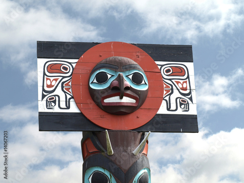 North American Totem Pole against a blue sky