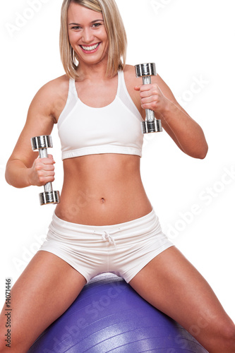 Fitness series - Smiling blond woman with weights © CandyBox Images