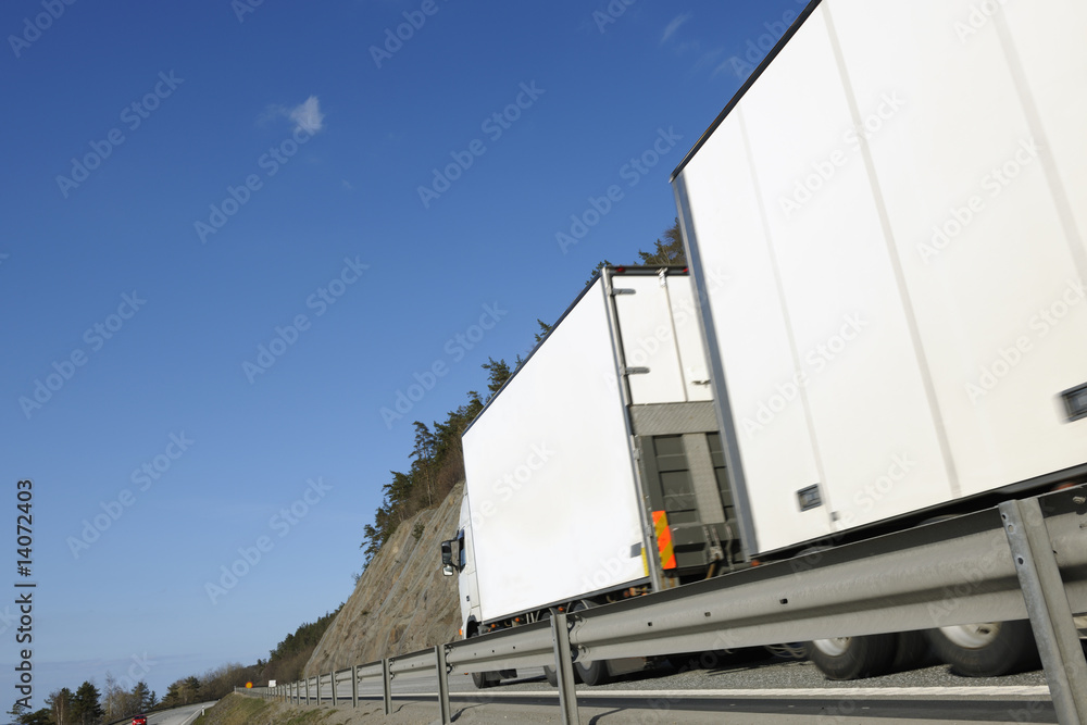 large truck zooming past large truck zooming past