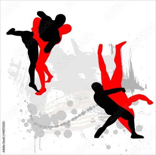 Silhouettes of wrestlers on abstract background.