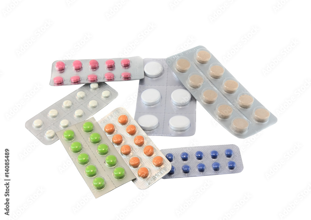 Coloured pills on white background. Top view. Isolated Coloured pills on white background. Top view. Isolated