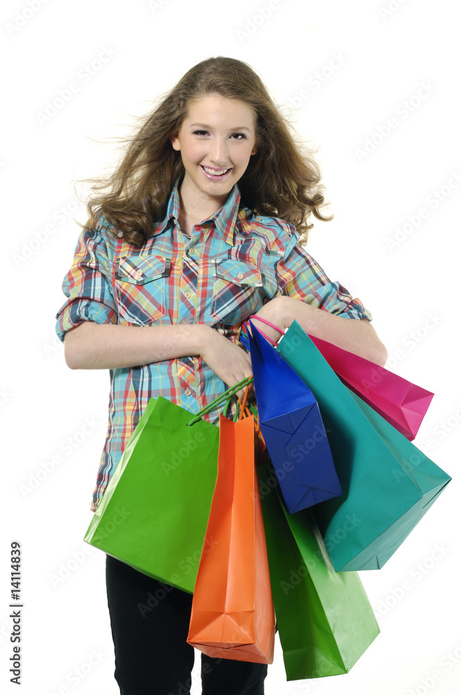 young woman holding several shopping bags. young woman holding several shopping bags.