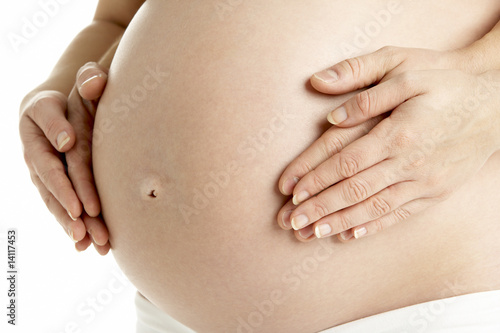 Couple Holding Pregnant Woman's Stomach