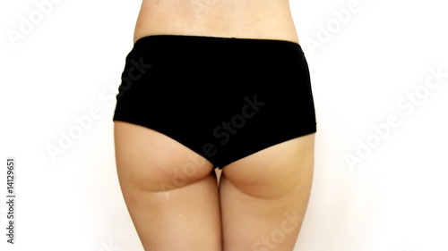 woman in black pants shaking her butt