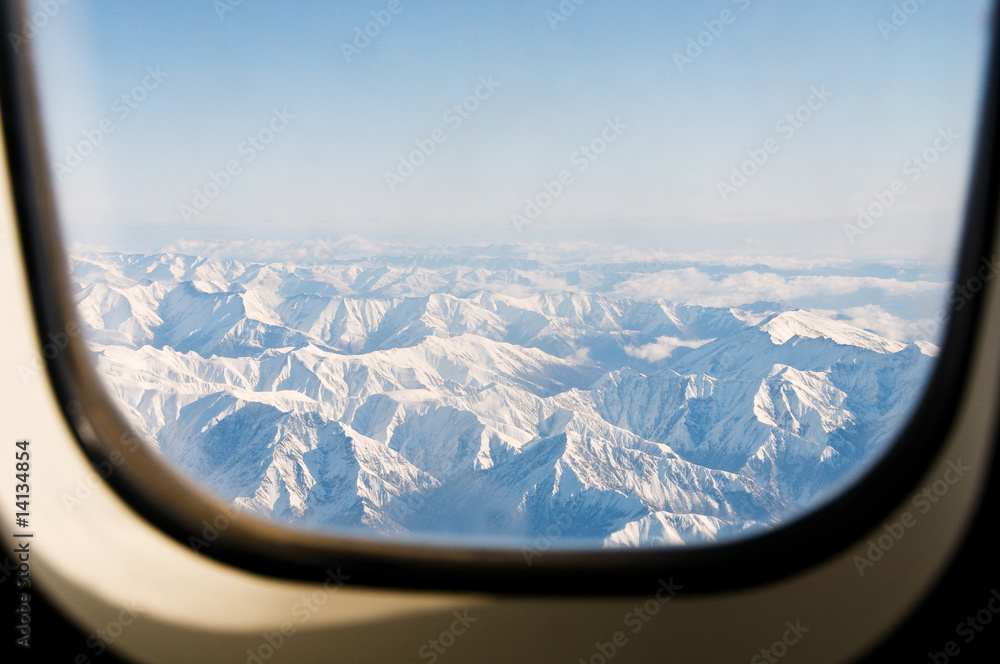 Obraz premium Winter mountains from the plane window