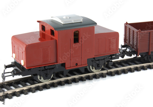 Toy Diesel Locomotive and freight wagon on white background