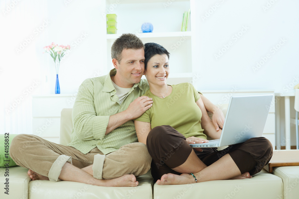 Couple browsing internet at home Couple browsing internet at home