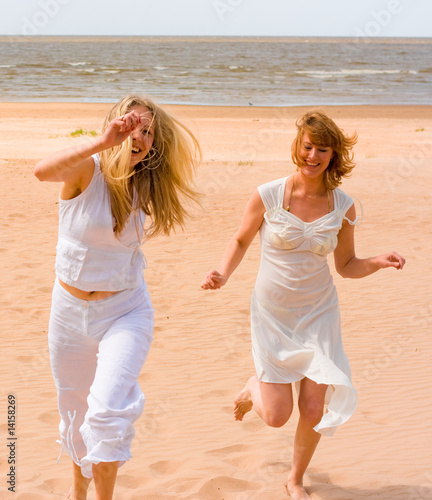 Girls running on a beach