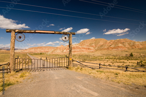 A gate and a fence in desert, wild west